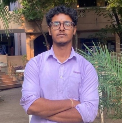 tushar standing with his hands folded